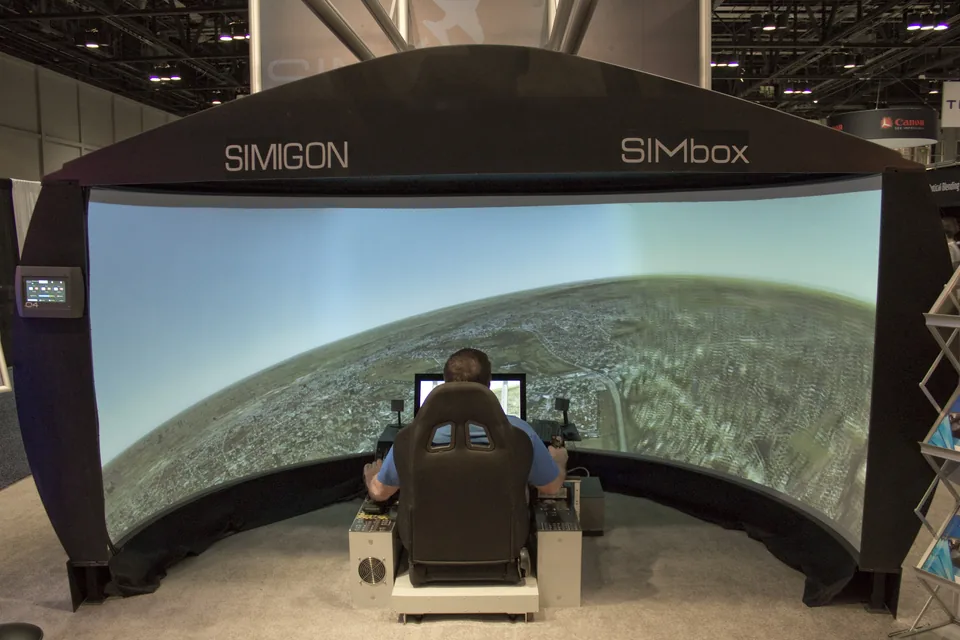 Cockpit station facing a curved wraparound display
