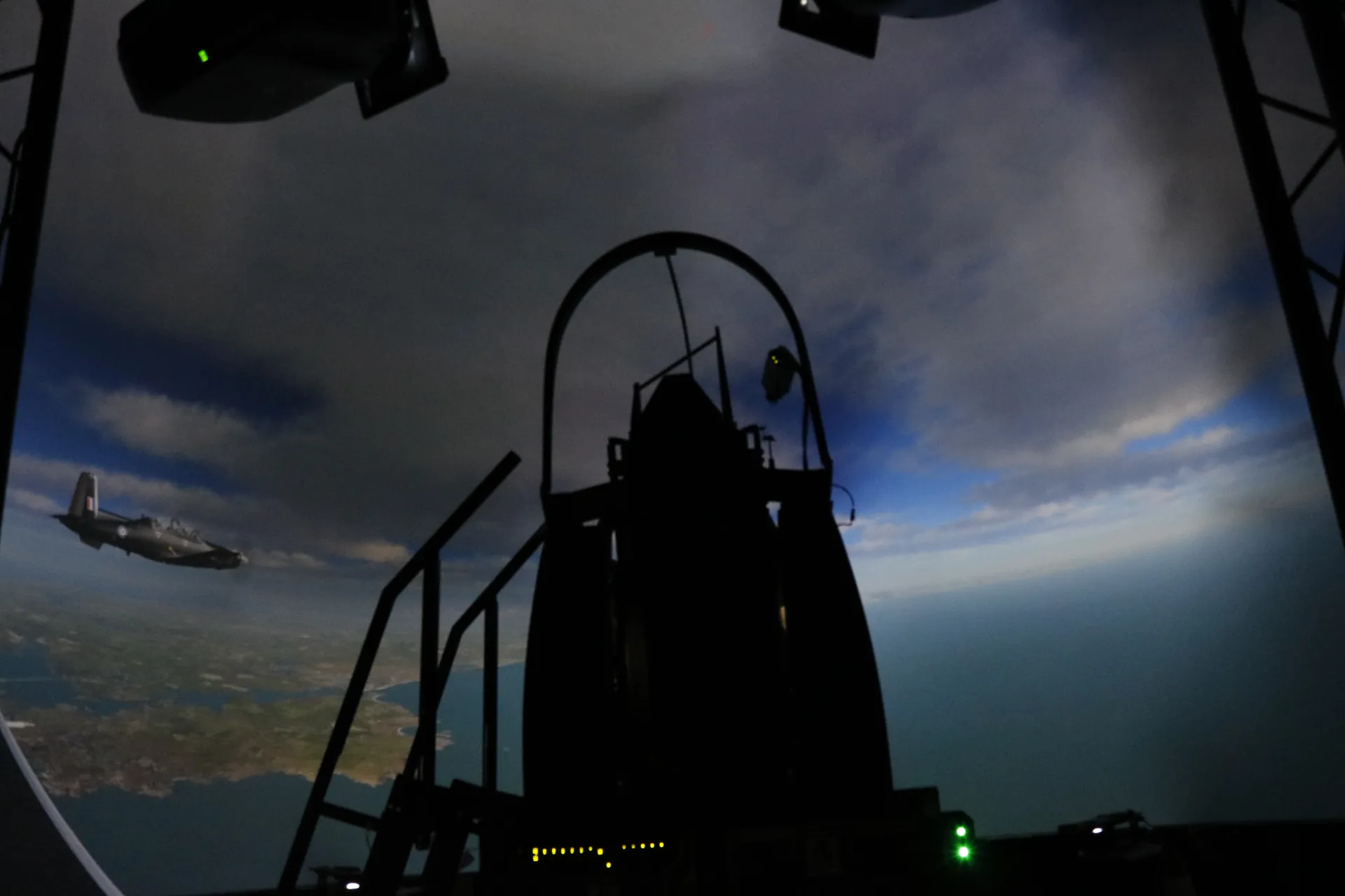 Replica cockpit inside a projection dome